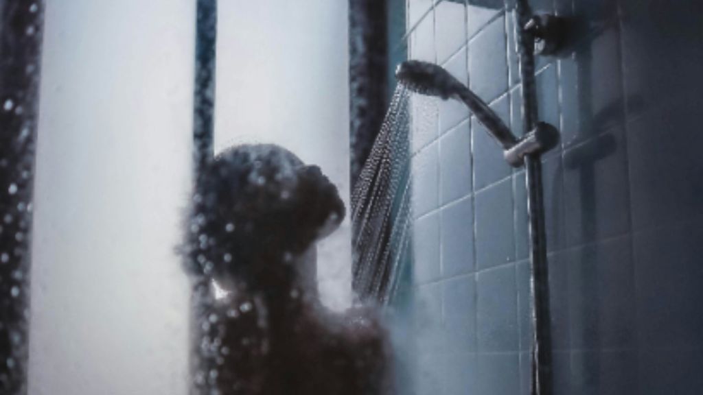 Woman in foggy shower