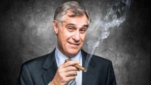 Businessman smoking a cigar