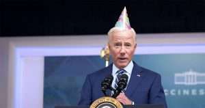 Joe Biden with party hat on