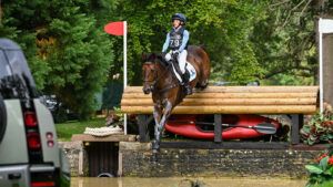 Ros Canter jumps the drop into the Trout Hatchery at Defender Burghley Horse Trials on overnight leader after cross-country Lordships Graffalo.