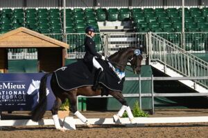 Sadie Smith riding Swanmore Dantina in the prizegiving lap of honour at the National Dressage Championships 2024.