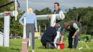 Frangible fences: Course builders fixing a frangible pin on a cross-country fence.