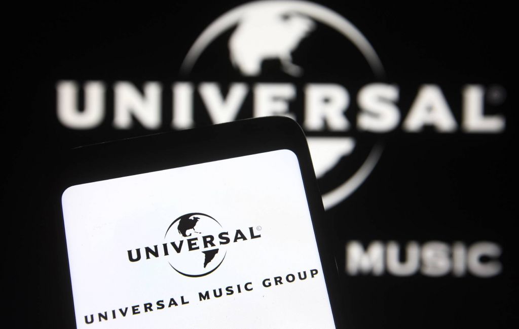 Universal Music Group (UMG) logo is seen on a smartphone and pc screen. (Photo Illustration by Pavlo Gonchar/SOPA Images/LightRocket via Getty Images)