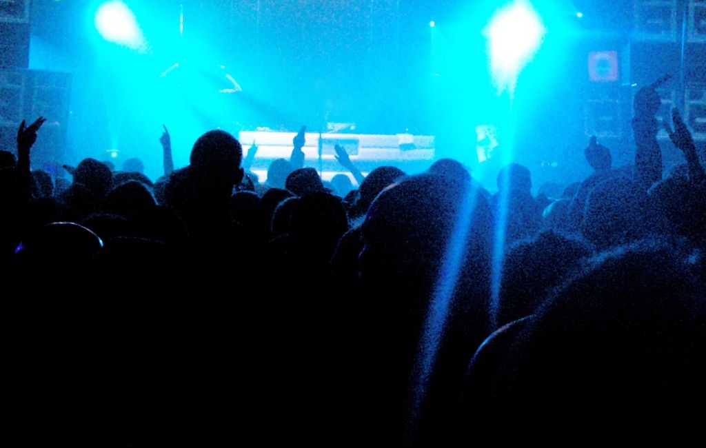 A large energetic crowd at a music gig (Credits: Getty)