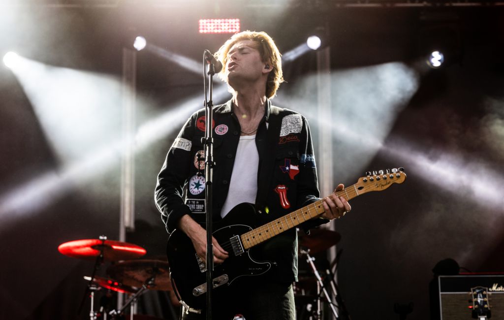 Matt Thomson performing live on stage with The Amazons