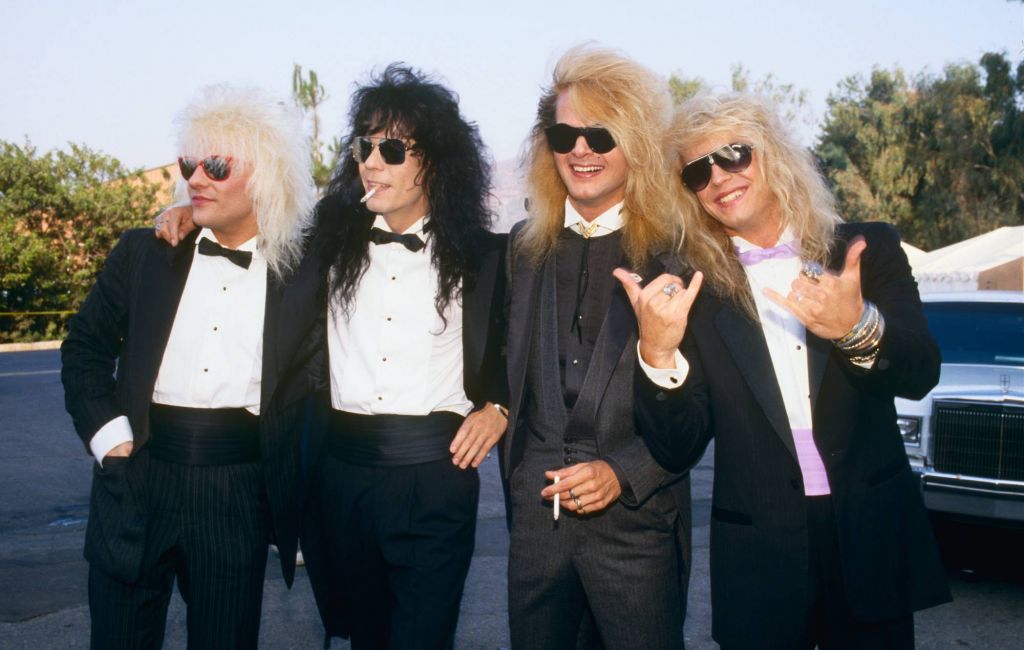 Members of the rock group Poison, Bret Michaels, C.C. DeVille, Rikki Rockett and Bobby Dall, pose on the red carpet at the 1987 Universal City, California, MTV Music Video Awards. (Photo by George Rose/Getty Images)