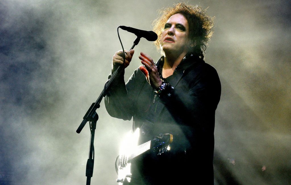 Robert Smith of The Cure performs live.