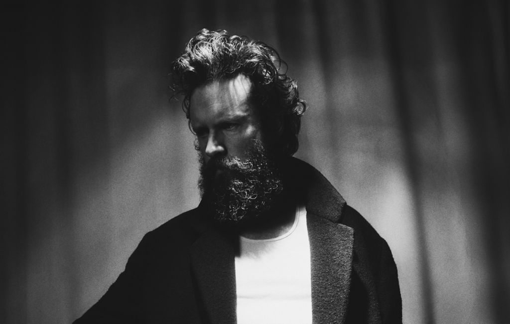 Father John Misty photographed in black and white, photo by Brent Goldman