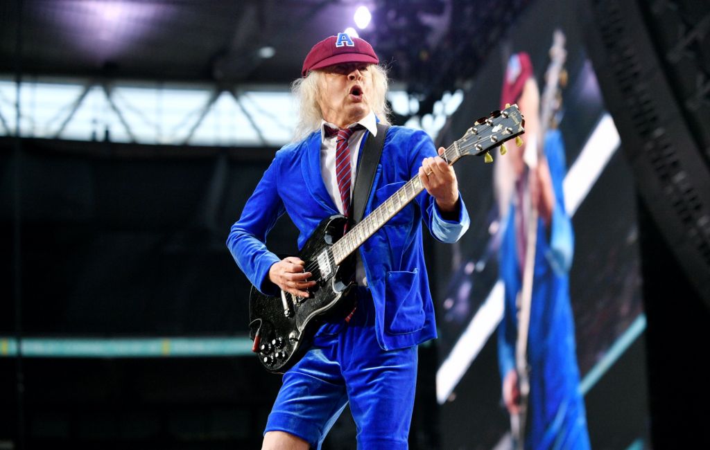 Angus Young performing live on stage with AC/DC