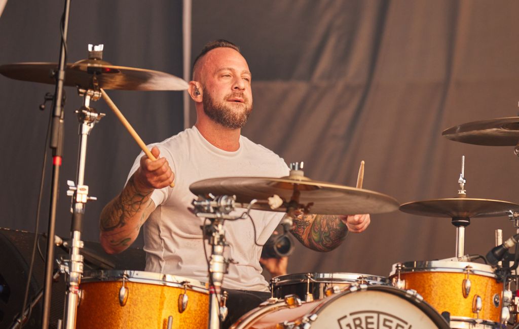 Mark O'Connell performing live on stage with Taking Back Sunday