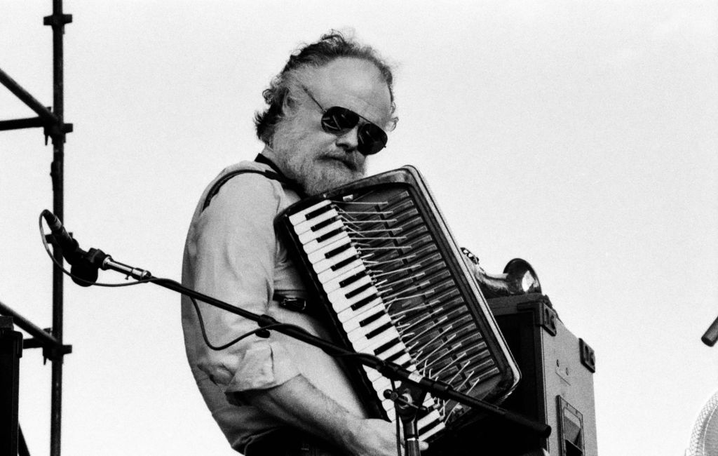 Garth Hudson, of the group the Band, plays accordion as he performs onstage. August 4, 1991. (Photo by Steve Eichner/Getty Images)