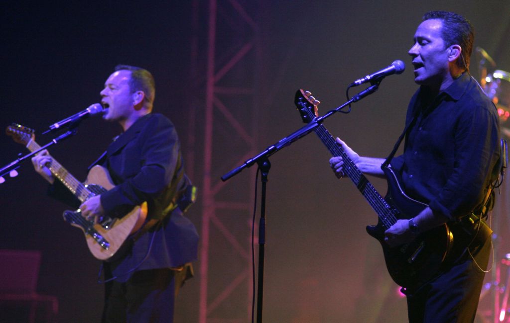 Ali Campbell and Robin Campbell performing live on stage with UB40