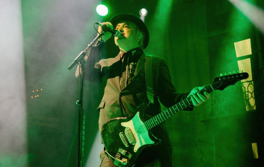 Pete Doherty performing live on stage with The Libertines