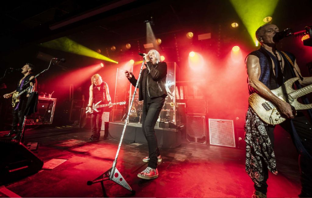 Def Leppard lead singer Joe Elliott (centre) with guitarist Vivian Campbell (left) and bassist Rick Savage (second left) perform on stage during their 'One Night Only' gig at the Leadmill in Sheffield