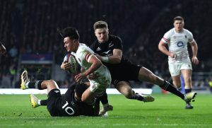 England's Marcus Smith is tackled by New Zealand's Richie Mo'unga and Beauden Barrett in the sides' autumn 2022 international match.