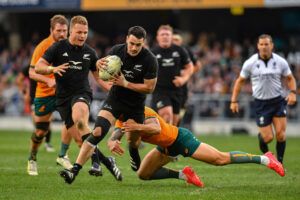 New Zealand's Will Jordan is tackled by Australia's Quade Cooper in the sides' 2023 Rugby Championship encounter.