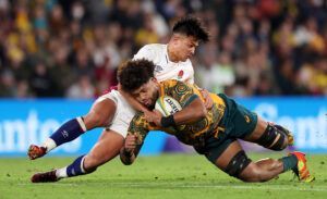 England’s Marcus Smith tackles Australia's Rob Valetini during a July 2022 test match.