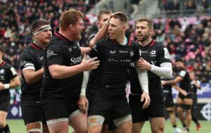 Saracens' Liam Williams celebrates with teammates after scoring against Stade Français in the December 2024 European Champions Cup match.