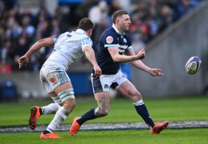 Scotland’s Finn Russell makes a pass against Italy, intercepted by Ignacio Brex