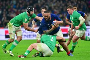 France's Uini Atonio powers past Irish defenders during the 2024 Six Nations match in Marseille