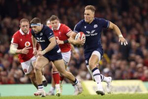 Scotland's Duhan van der Merwe breaks past Welsh defenders in the 2024 Six Nations match