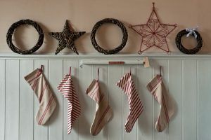 Five Christmas stockings hanging in a line