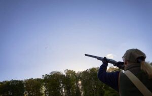 woman shooting shotgun