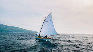 A whaling boat on fairly calm water