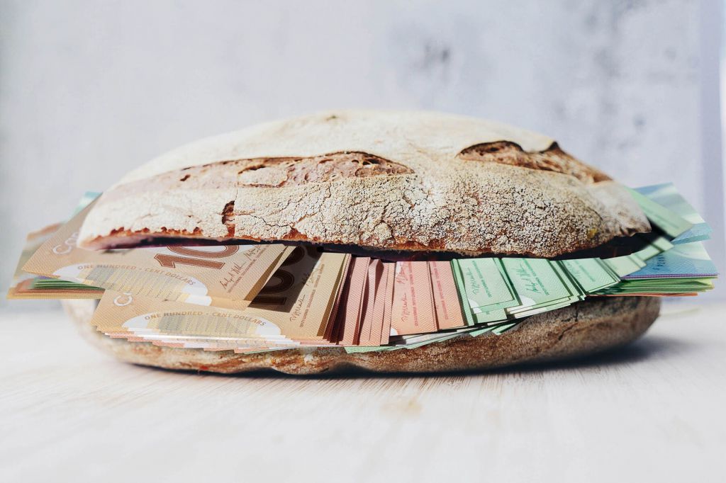 A sandwich filled with various Canadian bills.