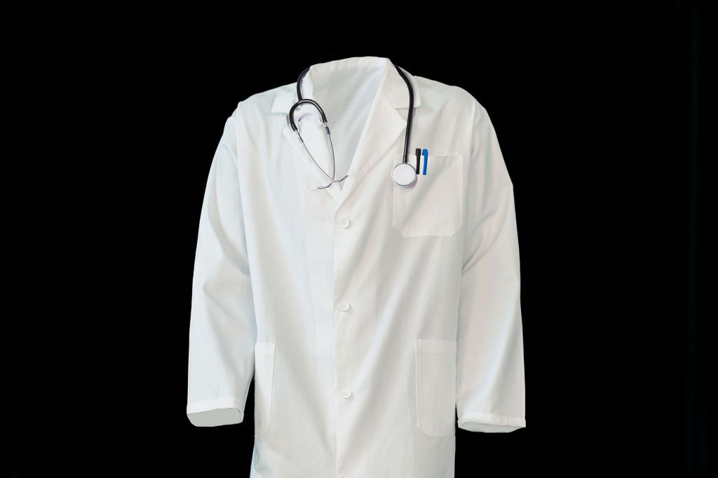 A doctor robe with a black background.