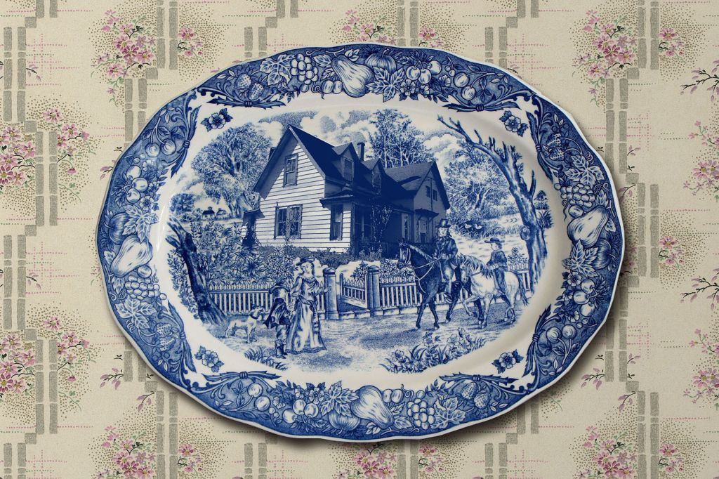 A blue and white old-timey plate featuring Emily Latimer's farmhouse.