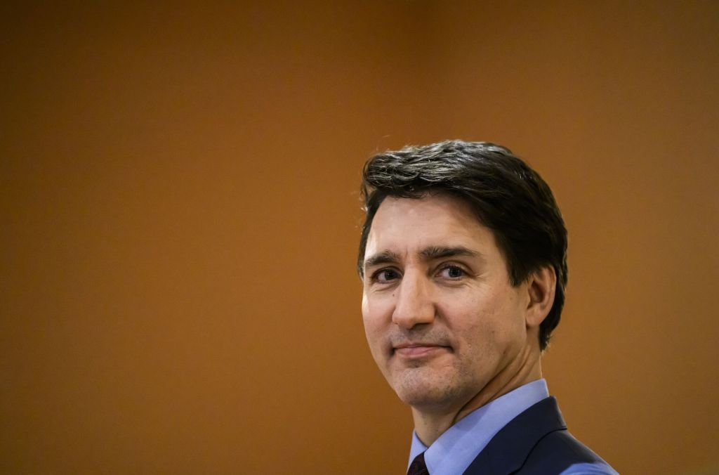 Prime Minister Justin Trudeau looks on at the start of a cabinet swearing-in ceremony for Dominic LeBlanc, not shown