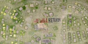 An aerial photo of the vacated encampment site with the words "We Will Return" painted on the earth.