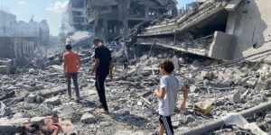 Palestinians inspect the damage following an Israeli airstrike on the El-Remal aera in Gaza City on October 9, 2023.