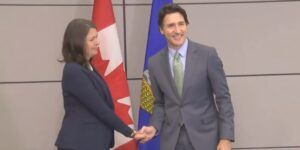 Danielle Smith and Justin Trudeau during their famously awkward handshake in 2020.