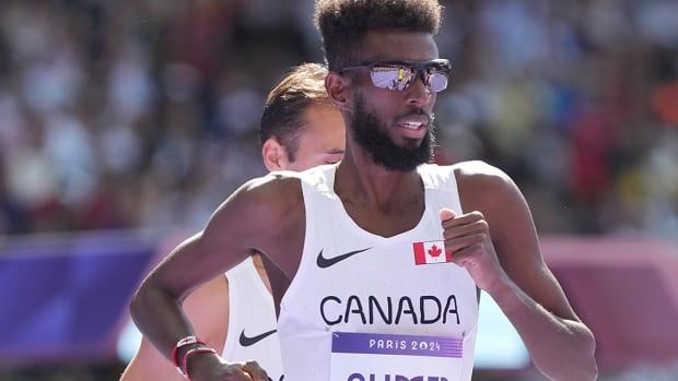 Canadian men's distance runner Moh Ahmed competes at the Stade de France in his 5,000-metre heat at the Paris Olympics on Aug. 7, 2024.