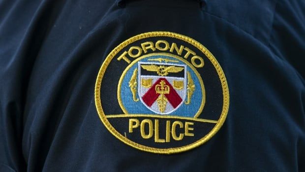 A Toronto Police Service logo patch is shown on an officer's uniform on Sept. 5, 2023.