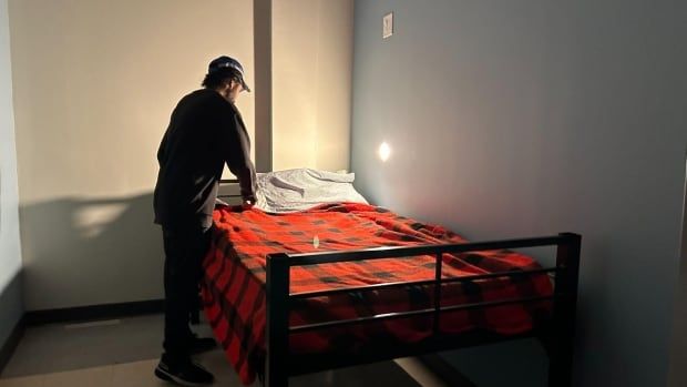 man and bed