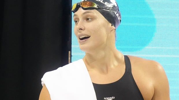 Swimmer Penny Oleksiak reacts after competing in the women's 100-metre freestyle at the Canadian Olympic trials in Toronto on May 17, 2024. 