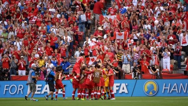 Team Canada celebrates following their 1-0 win over Switzerland following the second half of the FIFA Women's World Cup round of 16 soccer action against Switzerland in Vancouver, B.C., Sunday, June 21, 2015. THE CANADIAN PRESS/Jonathan Hayward