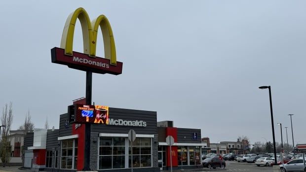 A fast food restaurant is seen on a cloudy day.