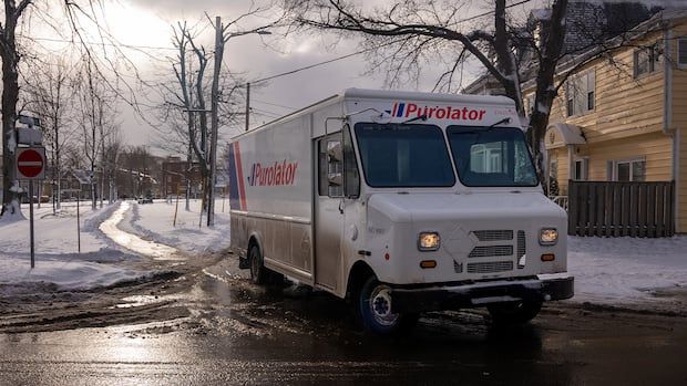 a courier truck at an intersection