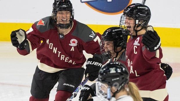 Montreal's Kristin O'Neill celebrates her goal against Boston with teammates Laura Stacey and Marie-Philip Poulin in a May 11, 2024 PWHL playoff hockey game in Laval, Quebec.