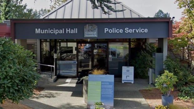 A building marked 'Municipal Hall Central Saanich Police Service' on a sunny day.