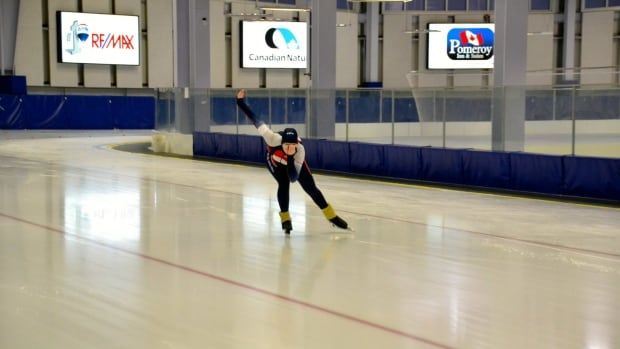 A speed skater on the ice.