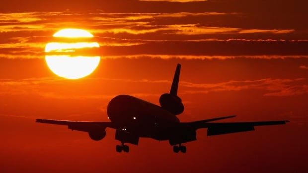 A commercial jet plane comes in for a landing.