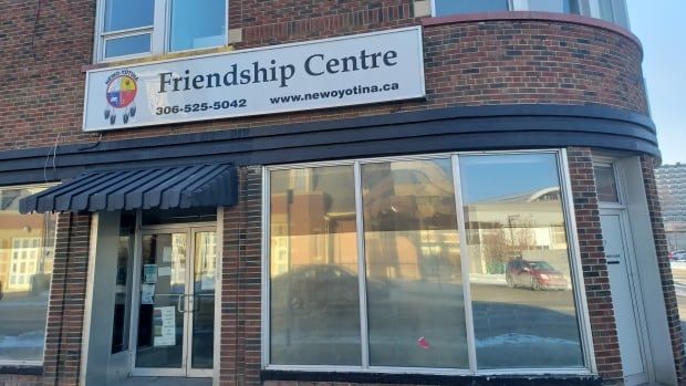 A brick building is shown in this photo. A sign on the building reads "Friendship Centre"