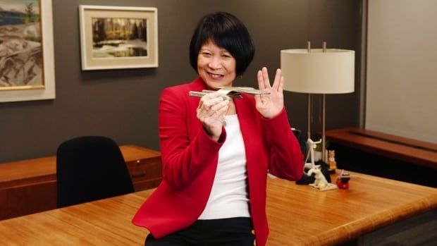 Toronto Mayor Olivia Chow holds a Star Trek model while demonstrating the 'Vulcan Salute' in her office in Toronto City Hall, on Thursday, December 19, 2024. THE CANADIAN PRESS/Chris Young