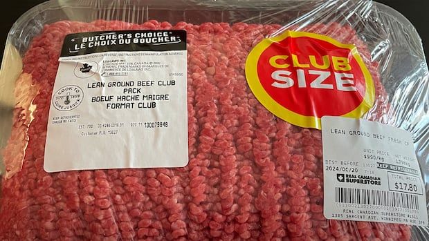 A package of ground meat with price stickers on it. 