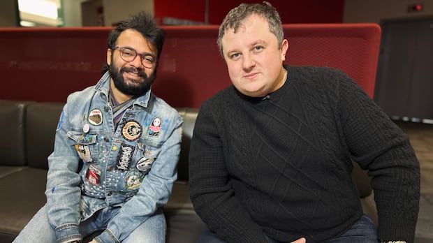 Two men smiling for a photo